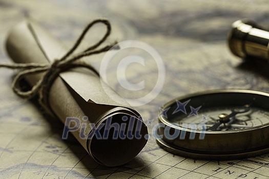 Concept of travel and discovery with old map and compass on it Concept of travel and discovery with old map and compass on it