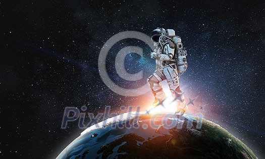 Astronaut in space suit running on Earth planet surface. Elements of this image are furnished by NASA