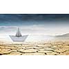 Dollar banknote ship in desert as symbol for financial crisis