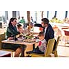 happy family enjoying lunch time together young parents with kids enjoying delicious meal at luxury restaurant