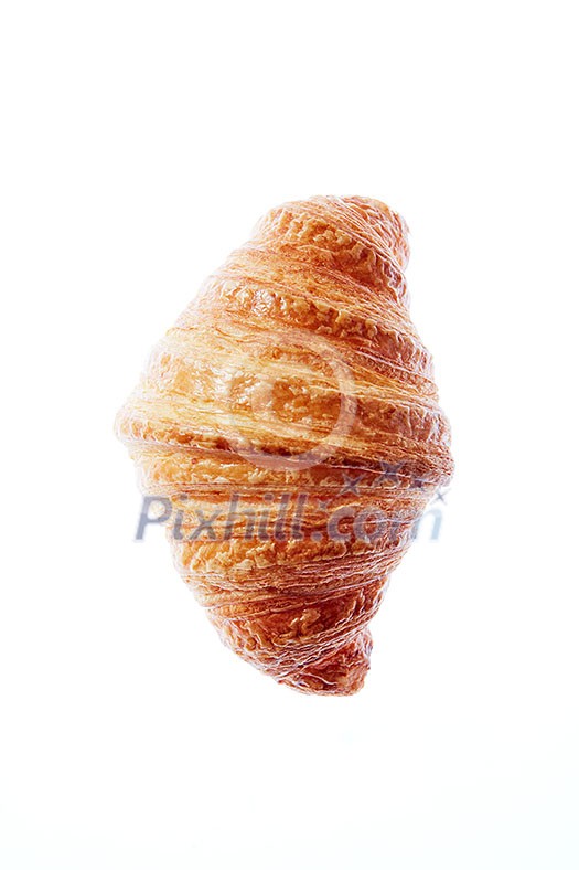 Delicious fresh french homemade croissant on a white background with copy space. Close up. Continental breakfast concept.