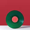 Green music record, on a double white red background with space for text. Retro audio technology