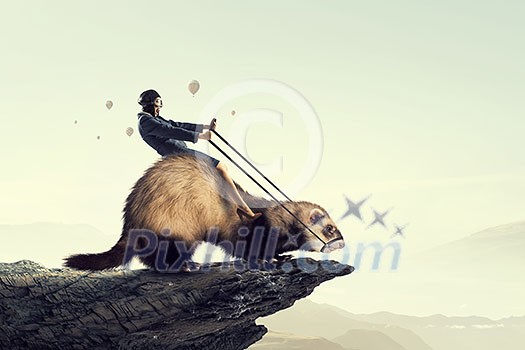 Young pretty fearless woman riding ferret animal Young pretty fearless woman riding ferret animal