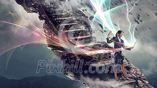 Elegant businesswoman on top of hill holdingn laptop . Mixed media Elegant businesswoman on top of hill holdingn laptop . Mixed media