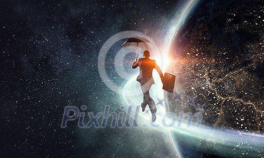 Cheerful businessman with umbrella and his suitcase running on globe. Elements of this image are furnished by NASA