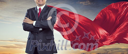 Aged businessman in red cape with arms crossed on chest. Mixed media Aged businessman in red cape with arms crossed on chest. Mixed media