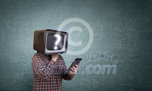 Man with TV monitor instead of head using tablet pc. Mixed media Man with TV monitor instead of head using tablet pc. Mixed media