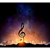 Silhouette of music sign on rock peak against starry sky. Mixed media