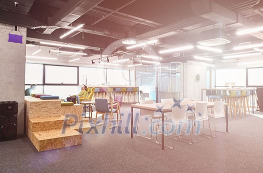 young software developers enjoying break in relaxation area of Modern sunny bright Open Plan Office young software developers enjoying break in relaxation area of Modern sunny bright Open Plan Office