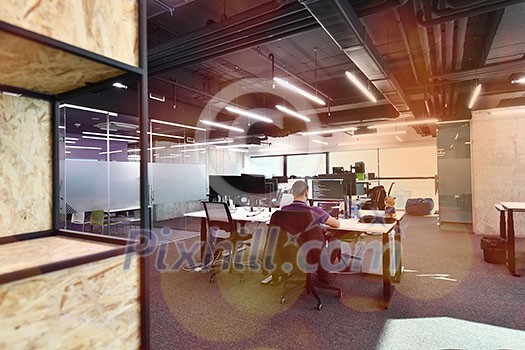 software developers working everyday job writing programming code at modern sunny bright open plan office