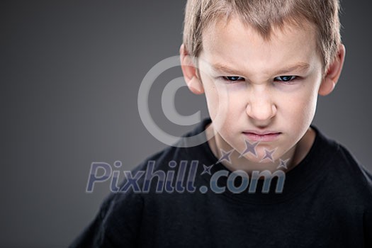 Loads of aggression in a little boy - education concept hinting behavioral problems in young children (shallow DOF) Loads of aggression in a little boy - education concept hinting behavioral problems in young children (shallow DOF)