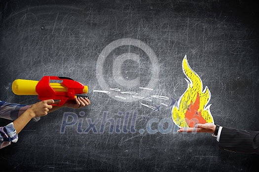Hand of person holding water gun toy Hand of person holding water gun toy