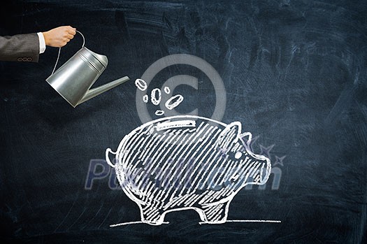 Hand of business person breaking piggy bank with hammer Hand of business person breaking piggy bank with hammer