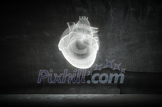 Hand holding human heart on concrete backround Hand holding human heart on concrete backround