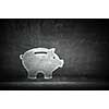 Piggy bank sign as symbol for savings on concrete background