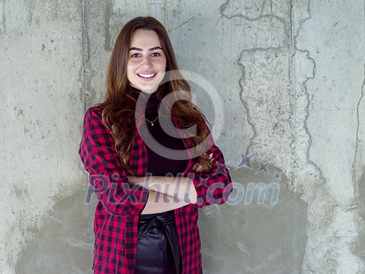 portrait of young female architect on construction site while checking documents and business workflow in new startup office