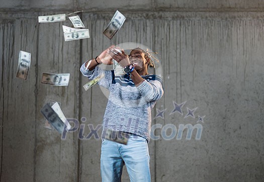 business, people and finances concept Happy young african american businessman throwing US dollar banknotes and enjoying while making the rain of money in new startup office business, people and finances concept Happy young african american businessman throwing US dollar banknotes and enjoying while making the rain of money in new startup office