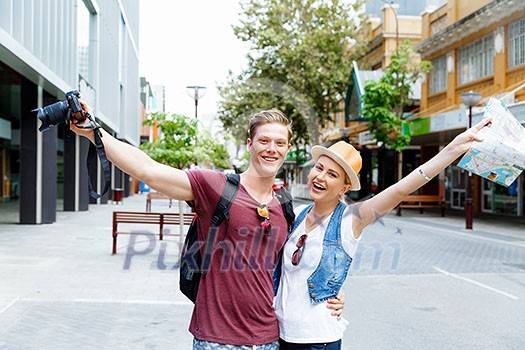 Young couple in city posing for a photo