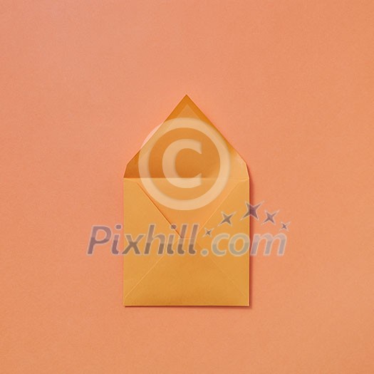 Mock up handmade open envelope for love letter on a light peach color background with copy space. Top view. Mock up handmade open envelope for love letter on a light peach color background with copy space. Top view.