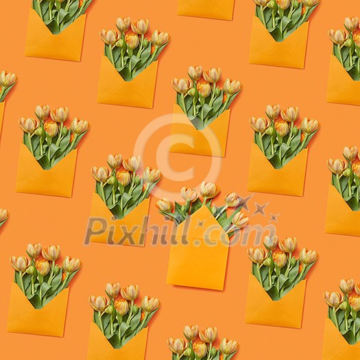 Handmade envelopes with fresh tulips bunch on a yellow background. Congratulation post card.