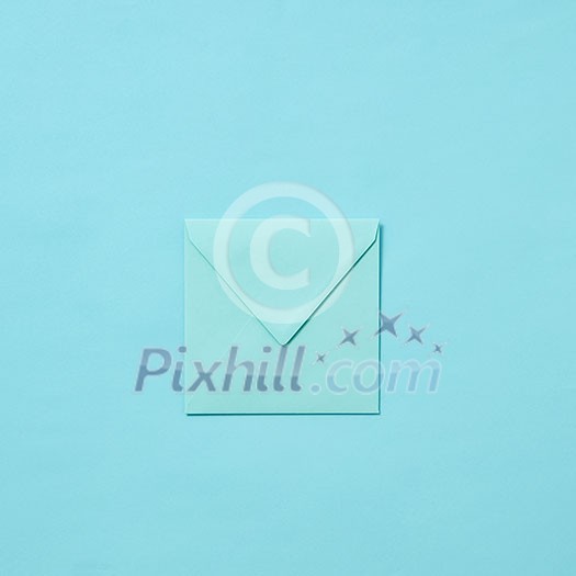 Mock up handmade envelope for greeting card or love letter on a pastel blue background with copy space. Top view. Mock up handmade envelope for greeting card or love letter on a pastel blue background with copy space. Top view.
