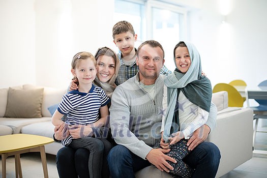 portrait of young happy modern muslim family before iftar dinner during ramadan feast at home portrait of young happy modern muslim family before iftar dinner during ramadan feast at home