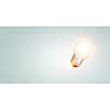 Glowing light bulb as creative idea concept. Mixed media