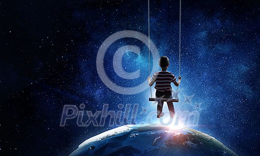Cute little girl riding on swing. Elements of this image are furnished by NASA Cute little girl riding on swing. Elements of this image are furnished by NASA
