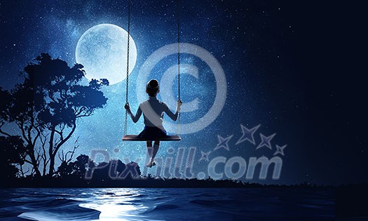 Cute little girl riding on swing. Mixed media Cute little girl riding on swing. Mixed media
