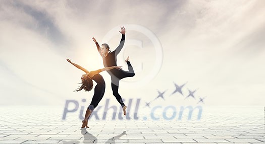 Couple of gymnasts dancing together. Mixed media Couple of gymnasts dancing together. Mixed media