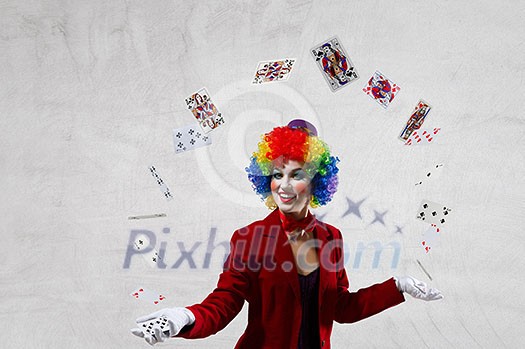 Woman with clown make up wearing wig juggling items . Mixed media Woman with clown make up wearing wig juggling items . Mixed media