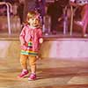 little cute girl carefully spending time while dancing in the kids disco