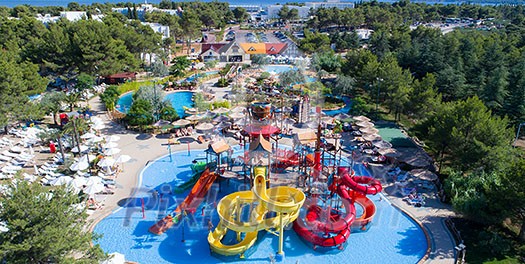 colorful water park aquapark water splash aerial top view of happy unidentified people and kids having fun and get relaxed