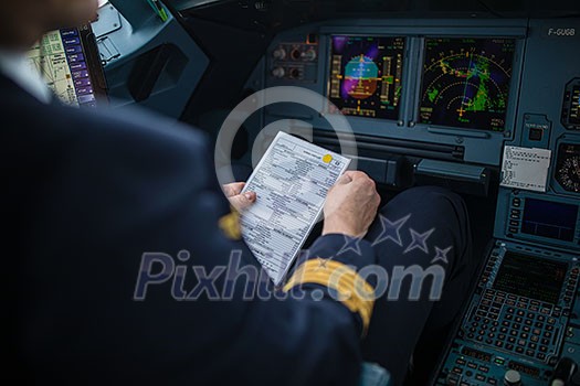 Pilot's hand accelerating on the throttle in a commercial airliner airplane flight cockpit during takeoff Pilot's hand accelerating on the throttle in a commercial airliner airplane flight cockpit during takeoff