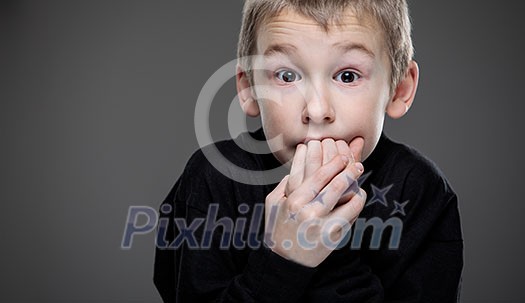 Anxiety/fear in a little boy - education concept hinting behavioral problems in young children (shallow DOF) - anxious/scared expression, biting his fingers Anxiety/fear in a little boy - education concept hinting behavioral problems in young children (shallow DOF) - anxious/scared expression, biting his fingers