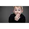 Anxiety/fear in a little boy - education concept hinting behavioral problems in young children (shallow DOF) - anxious/scared expression, biting his fingers