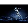 Woman cyborg running on dark background. Mixed media