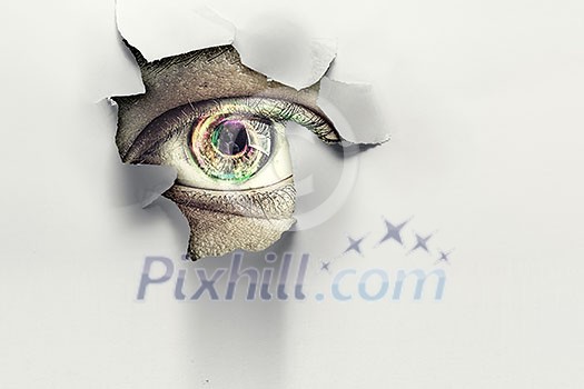 Male eye looks through hole in paper background. Mixed media