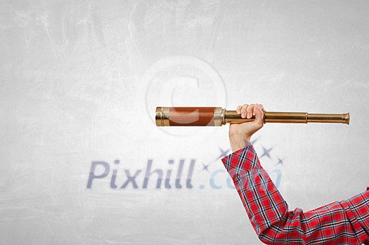 Close of woman holding in hands spyglass Close of woman holding in hands spyglass