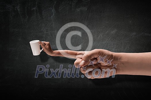 Person hand giving white cup on concrete background . Person hand giving white cup on concrete background .
