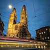Zurich, Switzerland - view of the Grossmünster church with motion blurred tramway during Chrostmas time