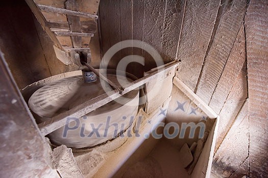 interior of retro wooden watermill with old equipment interior of retro wooden watermill with old equipment