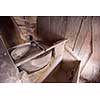 interior of retro wooden watermill with old equipment