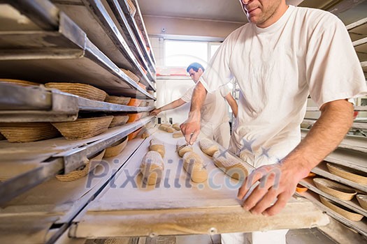 bakers preparing the dough for products In a traditional bakery