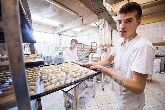 bakers preparing the dough for products In a traditional bakery