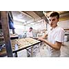 bakers preparing the dough for products In a traditional bakery