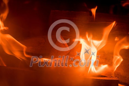 Fire background Burning firewood in the fireplace close up Fire background Burning firewood in the fireplace close up