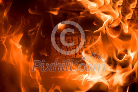 Fire background Burning firewood in the fireplace close up Fire background Burning firewood in the fireplace close up