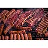 Assorted delicious grilled meat over the coals on barbecue