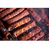 Assorted delicious grilled meat over the coals on barbecue